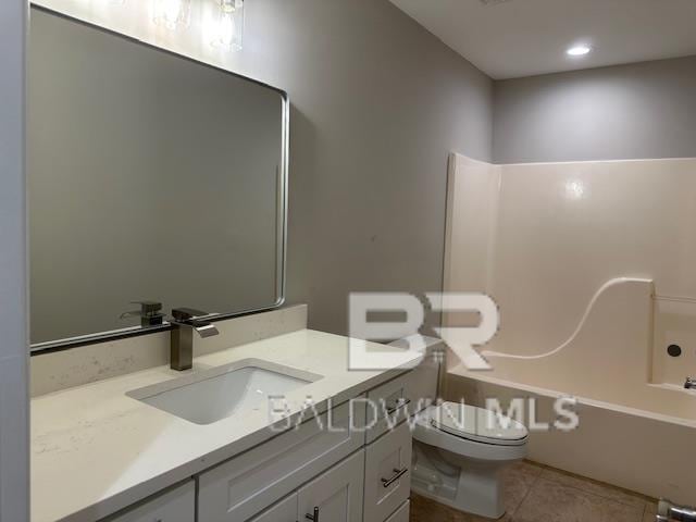 16825 Edward Dr, Gulf Shores, AL 36542 - full bath with toilet, tile patterned floors, vanity, and tub / shower combination