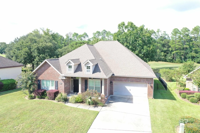 view of front of home featuring a garage and a front lawn