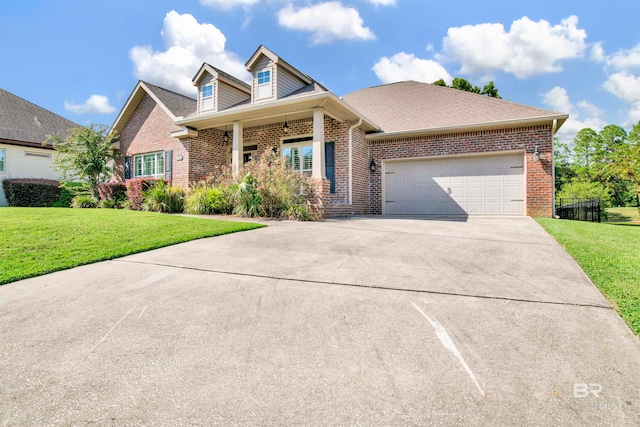 view of front of home featuring a garage and a front lawn