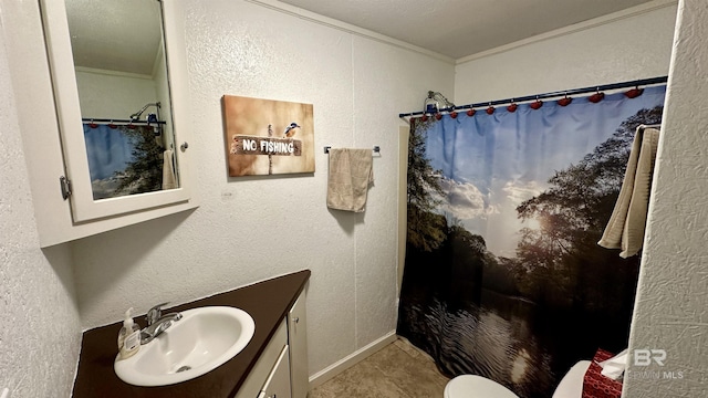 bathroom featuring crown molding, tile patterned flooring, vanity, and a shower with shower curtain