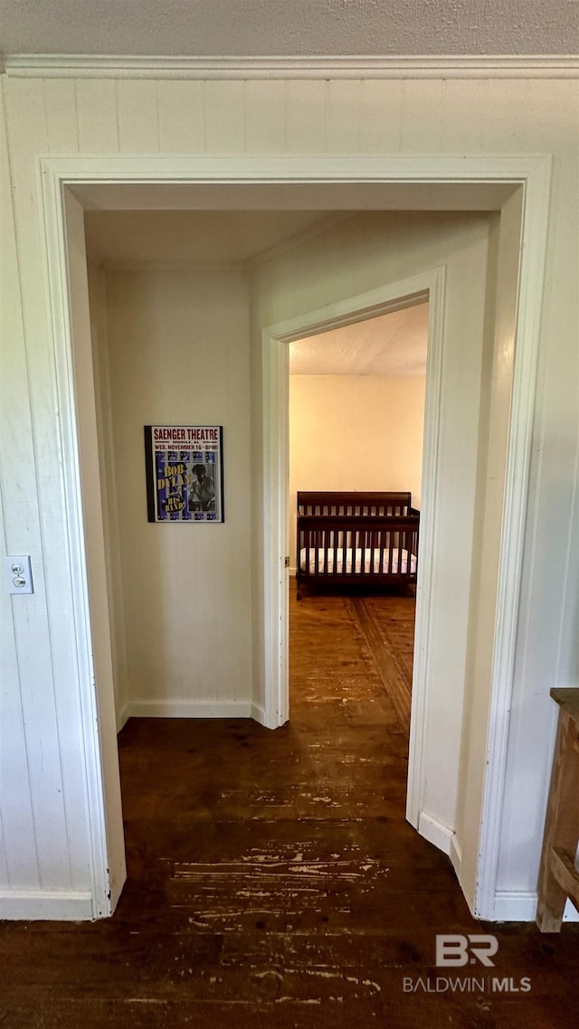 hallway featuring dark hardwood / wood-style floors