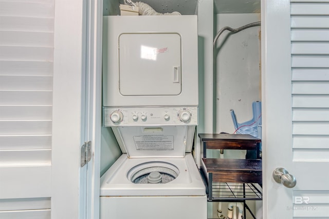 laundry area featuring stacked washer and dryer