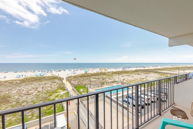 balcony with a view of the beach and a water view