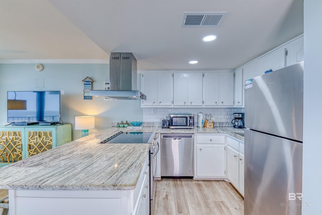 kitchen featuring island range hood, stainless steel appliances, and white cabinets