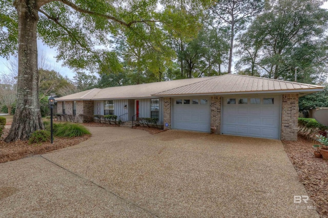 single story home featuring a garage