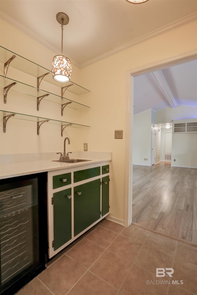 bar featuring lofted ceiling with beams, sink, wine cooler, hanging light fixtures, and crown molding