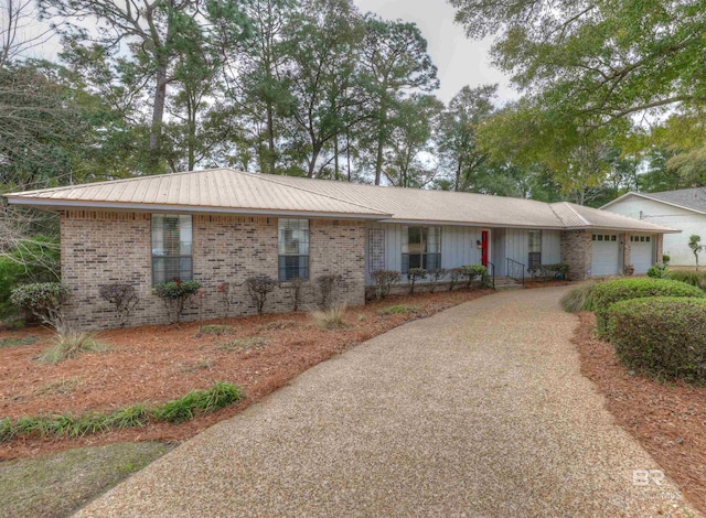 ranch-style house with a garage and covered porch