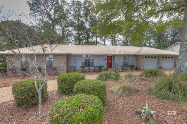 single story home featuring a garage