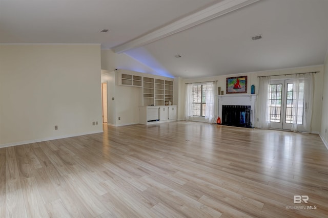 unfurnished living room featuring vaulted ceiling with beams, light hardwood / wood-style flooring, and plenty of natural light