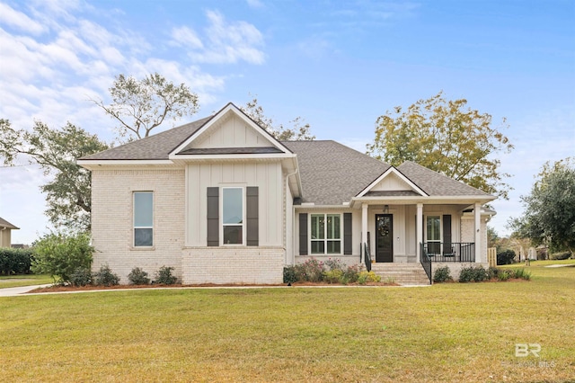 craftsman-style house with covered porch and a front yard