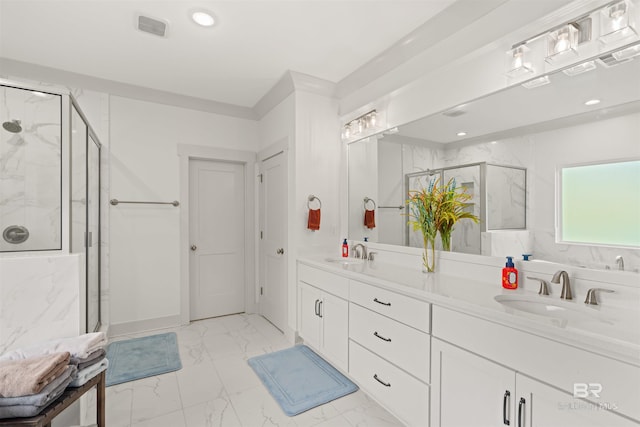 bathroom featuring vanity and an enclosed shower