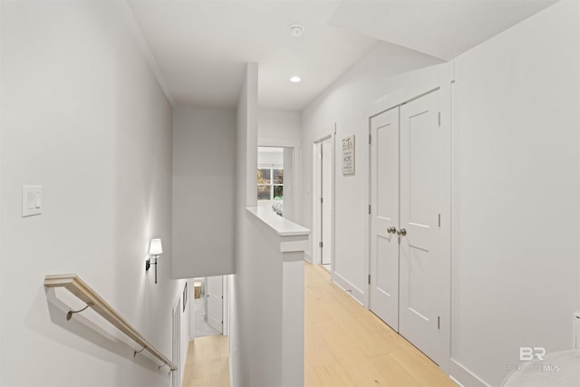 hallway with light hardwood / wood-style flooring