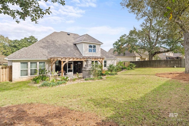 rear view of property with a patio area, a pergola, and a yard