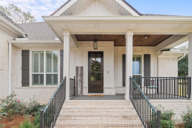 doorway to property featuring covered porch