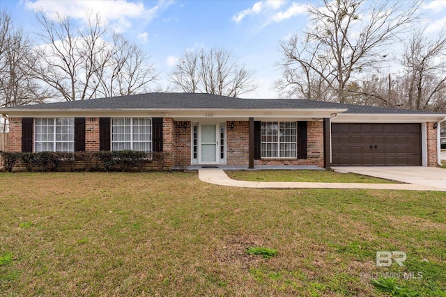 ranch-style house featuring driveway, brick siding, an attached garage, and a front yard