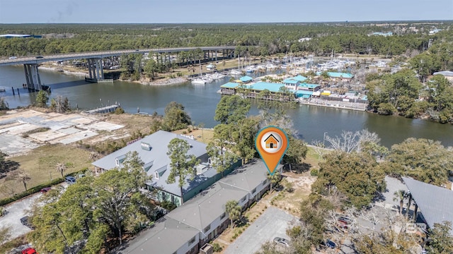 birds eye view of property with a water view