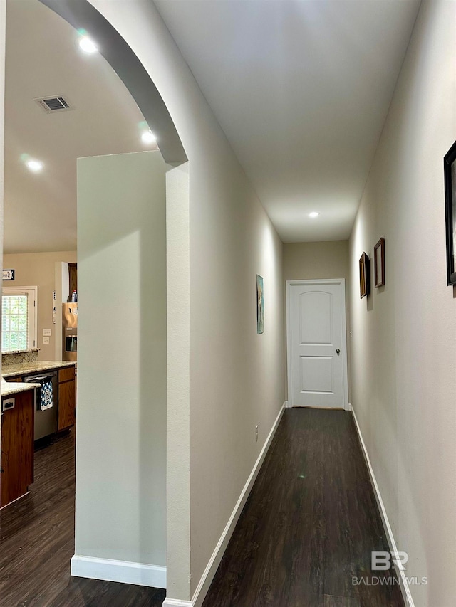 corridor featuring dark hardwood / wood-style floors