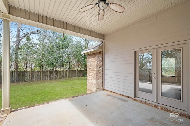 view of patio / terrace with ceiling fan, french doors, and fence