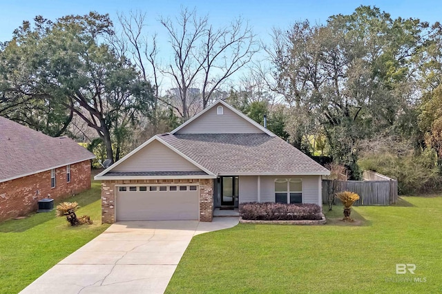 view of front facade with brick siding, an attached garage, fence, driveway, and a front lawn