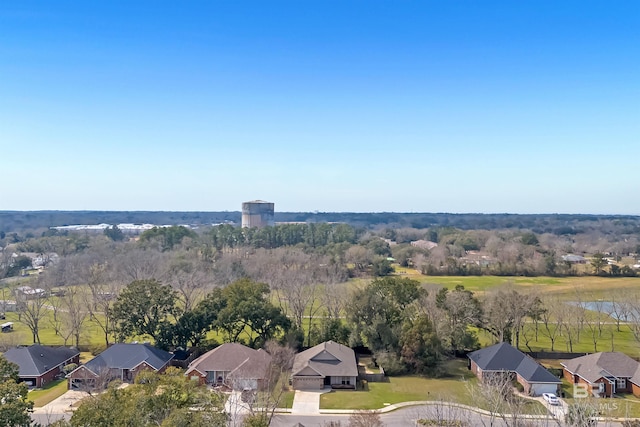 birds eye view of property with a residential view