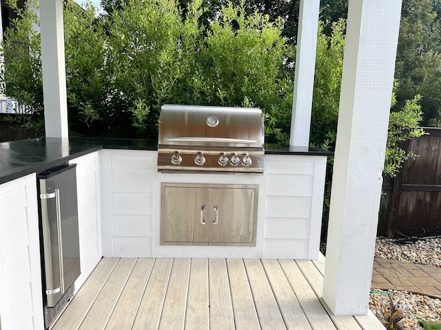 view of patio / terrace featuring area for grilling, wine cooler, and exterior kitchen