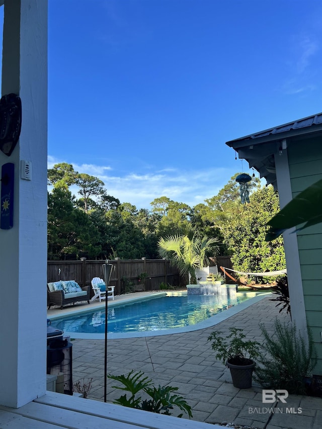 view of swimming pool featuring a patio