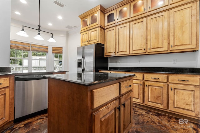 kitchen with decorative light fixtures, a center island, dark stone counters, and stainless steel appliances