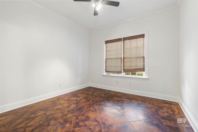 unfurnished room featuring ornamental molding, ceiling fan, and dark tile patterned floors