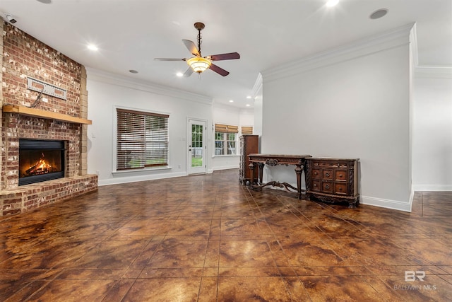 unfurnished living room with ceiling fan, a brick fireplace, and crown molding