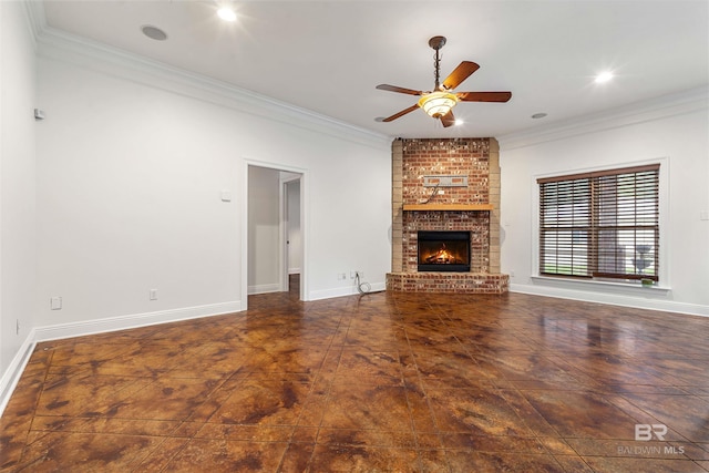 unfurnished living room featuring ceiling fan, crown molding, and a fireplace