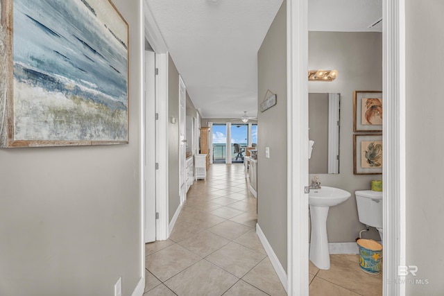27284 Gulf Rd Unit 711, Orange Beach, AL 36561 - corridor featuring light tile patterned floors and baseboards