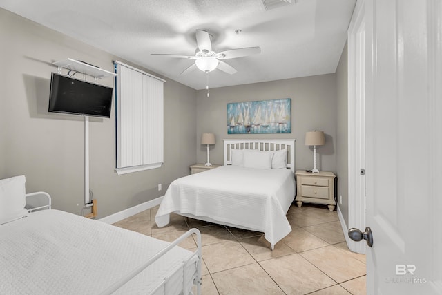 27284 Gulf Rd Unit 711, Orange Beach, AL 36561 - bedroom with light tile patterned floors, baseboards, and ceiling fan