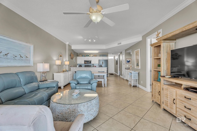 27284 Gulf Rd Unit 711, Orange Beach, AL 36561 - living area with ornamental molding, light tile patterned floors, ceiling fan, and baseboards