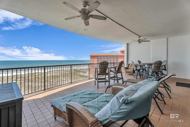 27284 Gulf Rd Unit 711, Orange Beach, AL 36561 - view of patio with a ceiling fan, view of water and beach, and a balcony