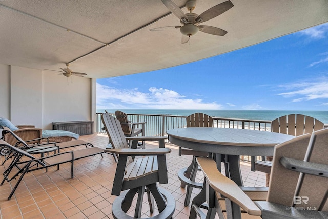 27284 Gulf Rd Unit 711, Orange Beach, AL 36561 - view of patio featuring a ceiling fan, outdoor dining area, and a water view