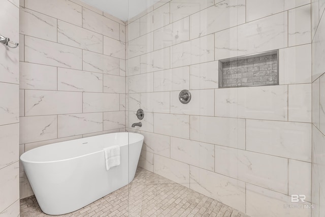 27284 Gulf Rd Unit 711, Orange Beach, AL 36561 - full bath with a freestanding bath, a tile shower, and tile walls