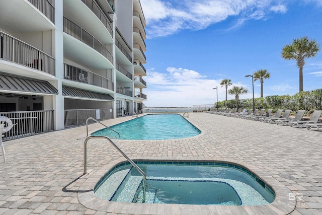 27284 Gulf Rd Unit 711, Orange Beach, AL 36561 - community pool with a community hot tub and a patio area
