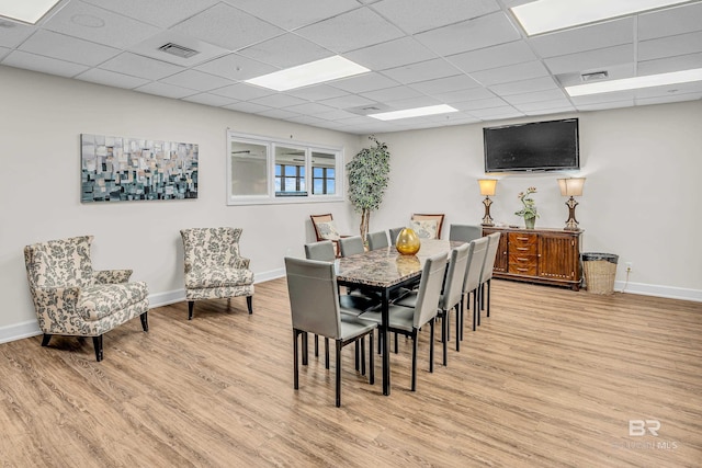 27284 Gulf Rd Unit 711, Orange Beach, AL 36561 - dining area featuring light wood-style floors, baseboards, and a drop ceiling