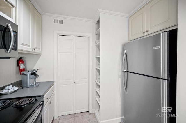 kitchen featuring appliances with stainless steel finishes, crown molding, and light tile patterned floors