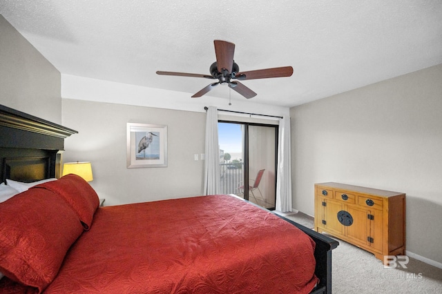 bedroom featuring access to outside, a textured ceiling, light carpet, and ceiling fan