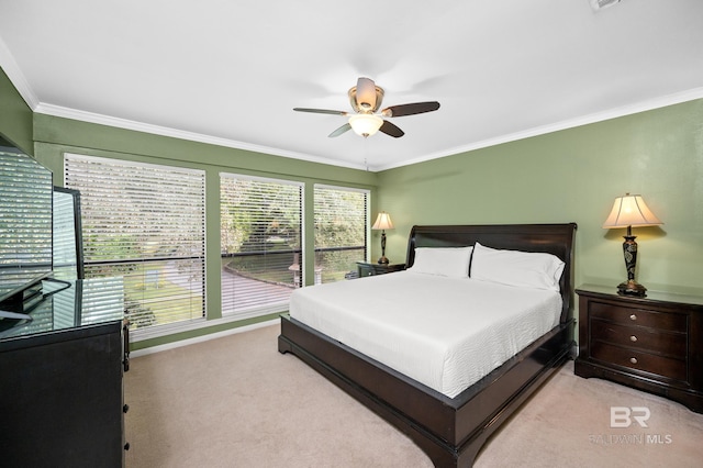 bedroom with ornamental molding, light carpet, and ceiling fan