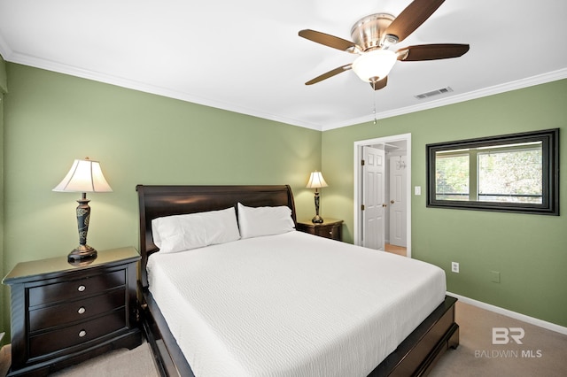 bedroom featuring ornamental molding, ceiling fan, and light colored carpet