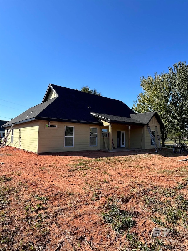 rear view of property featuring a patio