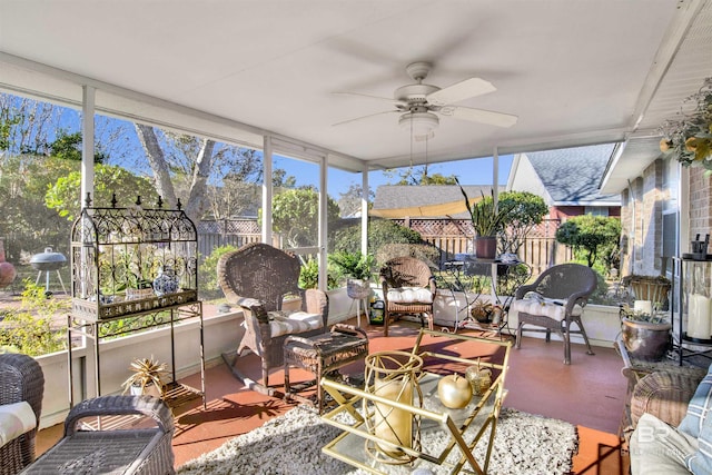 sunroom / solarium featuring ceiling fan