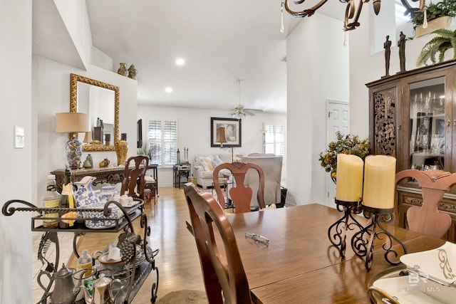 dining room with ceiling fan and light hardwood / wood-style flooring