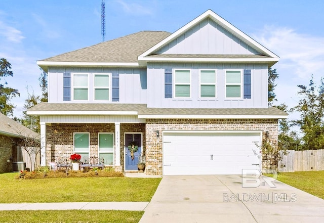 craftsman inspired home with central AC, a garage, and a front lawn