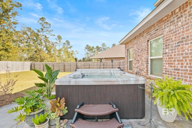 view of patio / terrace with a hot tub