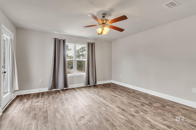 unfurnished room with wood-type flooring and ceiling fan