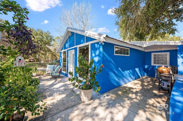 view of home's exterior featuring a patio