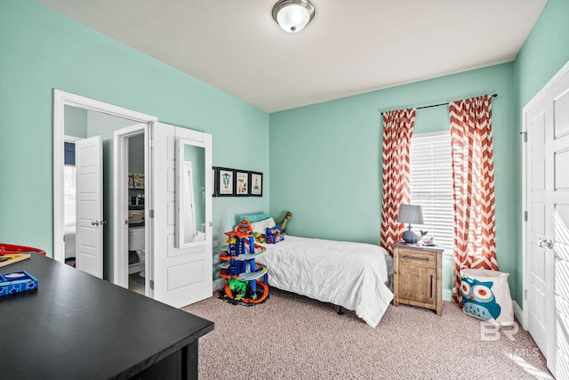 bedroom featuring carpet